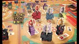 Board game with devil-themed miniature figures, including a red devil with fireworks, purple and black devils, drummers, and a fire-breathing beast. Terrain features paths, buildings, and numbered action cards. Text reads: "LET THE BEASTS DANCE!"