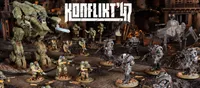 A dynamic scene from Konflikt '47 features a variety of detailed miniatures set in a war-torn environment. In the foreground, U.S. Airborne soldiers in green uniforms wield weapons, while Axis soldiers in heavy armor and distinctive designs stand ready for battle. The backdrop includes ruined structures and scattered debris, enhancing the atmosphere of this alternate history conflict. The title "KONFLIKT '47" is prominently displayed at the top.