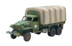 A military-style truck with a green body and a camouflaged canvas cover over the cargo area. The truck features a white star insignia on the side and has visible weathering and paint wear, indicating use. It has six wheels, with the front wheels showing a distinct tread pattern.