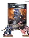 A boxed set for "Warhammer 40,000 Combat Patrol" featuring three painted miniature figures. At the top of the box, bold white text reads "WARHAMMER 40,000" and "COMBAT PATROL" with a red downward-pointing triangle between them. The number "01" is visible in a red circle on the top right corner of the box.

The box art displays three miniatures:
1. A Space Marine Captain in blue armor with white and gold details, holding a power sword and a bolt pistol.
2. A large, armored figure in blue with a heavy weapon, identified as a Space Marine.
3. A creature labeled as a Winged Tyranid Prime with large wings, claws, and a monstrous appearance.

In front of the box, two of the miniatures are positioned on rocky bases:
1. On the left, a Space Marine Captain in blue armor with white and gold details, holding a power sword.
2. On the right, a Winged Tyranid creature with large wings and claws.

The bottom of the box has text that reads: "FIRST MODELS