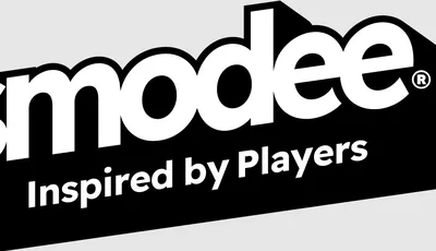 The image features the Asmodee logo, prominently displayed in bold, modern typography. The word "Asmodee" is in large, white letters against a black background, with the tagline "Inspired by Players" in smaller white text below. The overall design conveys a sleek and professional aesthetic, reflecting the brand's focus on tabletop gaming.