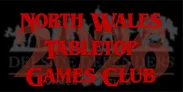 Bold red text displays "NORTH WALES TABLETOP GAMES CLUB" prominently, with the year "2026" featured below it. The background is dark, enhancing the visibility of the text, while subtle imagery related to gaming is faintly visible behind the main elements. This design emphasizes the club's upcoming events and activities.