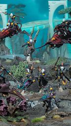 A dynamic scene showcases a group of Harlequin miniatures from Games Workshop, featuring vibrant colors and intricate details. The display includes two Skyweavers and a Starweaver, with Harlequin models in various poses, some wielding weapons and others in dramatic stances. The background features a fantastical landscape with alien flora, enhancing the colorful and theatrical theme of the Harlequins.