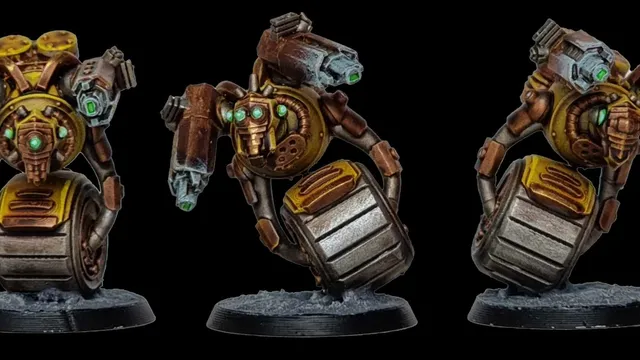 A detailed miniature of a robotic character features a round body with a metallic, silver barrel-like base and a prominent, circular golden core. It has two mechanical arms, one equipped with a green-tipped weapon and the other with a series of intricate gears and glowing green eyes. The figure stands on a textured black base, showcasing a weathered, industrial aesthetic with hints of rust and wear.