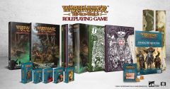 A collection of Warhammer: The Old World roleplaying game products is displayed, featuring several books and accessories. Prominently shown are the core rulebook, a player's guide, and a collector's edition, all adorned with intricate artwork. Additionally, there are packs of cards, a character sheet pad, and various dice, emphasizing the comprehensive nature of the available bundles.