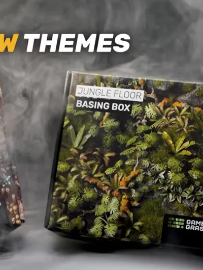 Two boxes labeled "JUNGLE FLOOR BASING BOX" and "CHAOS WASTELAND BASING BOX" with smoke.