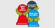 Three award trophies are displayed, each representing a different category of the Spiel des Jahres. The red trophy, labeled "Spiel des Jahres," features a laurel wreath design, symbolizing the Game of the Year. The gray trophy, labeled "Kennerspiel des Jahres," represents the Connoisseur Game of the Year, while the blue trophy, labeled "Kinderspiel des Jahres," signifies the Children's Game of the Year. All trophies are marked with the text "KRITIKERPREIS" at the base.