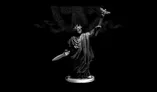 A 28mm scale miniature of Caesar Imperator stands prominently against a dark background. The figure is cast in white metal, showcasing intricate details such as a laurel crown and flowing robes. In one hand, he holds a sword, while the other is raised, delicately supporting a butterfly, symbolizing peace or transformation. The base is circular, providing stability to the figure, which is sculpted with a sense of grandeur and historical significance.