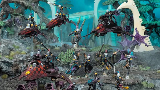 A dynamic scene showcases a group of Harlequin miniatures from Games Workshop, featuring vibrant colors and intricate details. The display includes two Skyweavers and a Starweaver, with Harlequin models in various poses, some wielding weapons and others in dramatic stances. The background features a fantastical landscape with alien flora, enhancing the colorful and theatrical theme of the Harlequins.