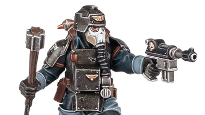 A detailed miniature figure of a Death Korps of Krieg Combat Engineer, wearing a dark uniform and a distinctive helmet with a skull motif. The figure is equipped with various tools and weapons, including a pistol in one hand and a device in the other. The overall color scheme features dark tones with metallic accents, emphasizing the character's militaristic design.