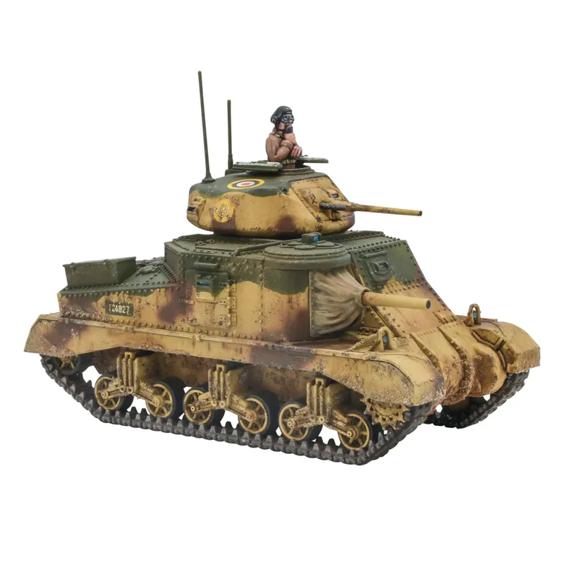 A detailed model of the M3 Grant medium tank, featuring a camouflage paint scheme with shades of green and brown. The tank has a prominent turret with a circular insignia and a figure of a soldier wearing a helmet, positioned on top. The model showcases intricate details, including the tracks and various components, emphasizing its design as a WWII U.S. vehicle.