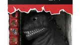 Yahtzee Godzilla box with Godzilla dice cup and red dice.
