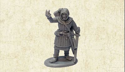 A grey resin miniature of the Master Fletcher stands on a circular base, depicted in a friendly pose with one hand raised in a gesture. He is dressed in a hooded cloak and tunic, with a quiver of arrows slung over his shoulder and a sword at his side. The background features a textured, light-colored surface that enhances the focus on the figure.