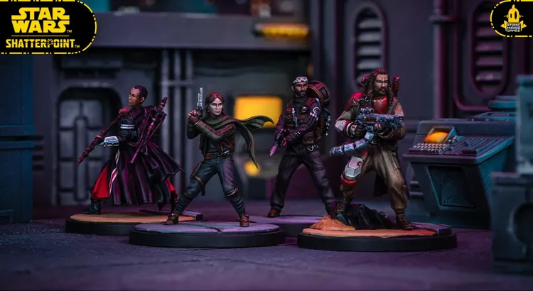 A detailed scene features three miniature figures from the Star Wars: Shatterpoint game, set against a futuristic backdrop with dark, industrial elements. On the left, a character in a flowing cloak stands poised, while the center figure, dressed in tactical gear, holds a blaster. The third figure, wearing a red and beige outfit, is equipped with a weapon and stands on a rocky base, with a control panel visible in the background. The overall color scheme includes dark tones with hints of vibrant colors, enhancing the sci-fi atmosphere.
