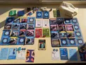Spread of Burgle Bros 3 game cards, tokens, and dice on a table.