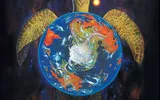 A giant golden turtle carrying a blue globe with continents, stars, and a red sun. Text: "Discworld Adventures in Ankh-Morpork".