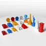 Colorful 3D-printed landmarks, tanks, coins, and barrels on a white surface.