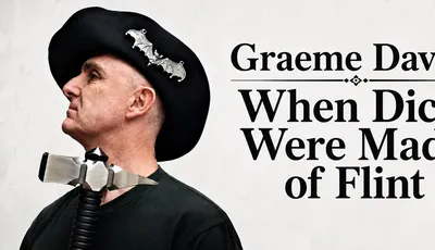 Man in black beret with bat pins, wearing a metal device around neck, black shirt.