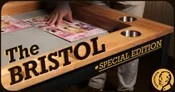 Wooden tabletop game board with two circular cutouts, labeled "ROOL" in bold black letters. Below, "SPECIAL EDITION" in yellow. Geekson logo with stylized owl and text on right corner.