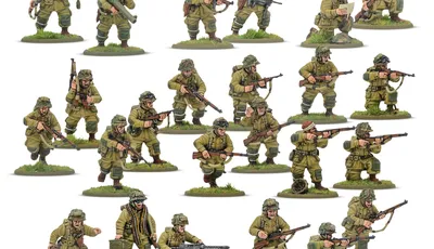 A collection of multi-part plastic miniatures representing US Airborne soldiers in early war, reinforced M42 jump uniforms. The figures are posed in various action stances, showcasing a range of weapons including rifles, submachine guns, and a bazooka, along with additional gear like magazine pouches and a signal lamp. The miniatures are set on grassy bases, highlighting their detailed sculpting and variety within the thirty-man platoon.