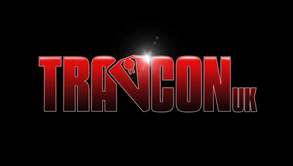 The image features the logo for "Travcon," prominently displayed in bold, red letters against a black background. The "TRA" portion of the logo is stylized, with a key symbol integrated into the letter "V," adding a unique touch. The overall design conveys a sense of excitement and adventure, fitting for a convention dedicated to the Science Fiction RPG game, Traveller.