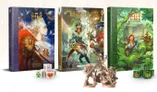 Three roleplaying game books are displayed prominently: "Adventures in the Household 5E" in the center, featuring a colorful cover with a character in a military-style outfit, surrounded by fantastical elements. To the left is "Household Volume I," showcasing an ethereal figure against a cosmic background, while to the right is "Household Volume II," adorned with intricate green foliage. In the foreground, several unpainted miniatures depict various characters, alongside a set of colorful dice featuring symbols from the game.