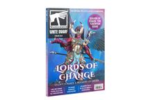 The cover of White Dwarf Issue 514 features a striking illustration of a Tzeentch character, adorned in ornate armor with vibrant colors, including blues and golds. The character has large, colorful wings and a confident pose, embodying the theme of chaos and change. Prominent text on the cover includes "Lords of Change" and "Tzeentch Makes a Mockery of Order," along with a circular badge indicating it is the "Season of Chaos: The Tzeentch Issue."
