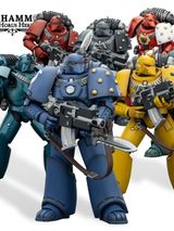A group of eight tactical space marine action figures stands prominently, showcasing a variety of colors and chapter insignias. The marines are depicted in their original mark of armor, with detailed features and gear, including bolt guns and backpacks. The figures represent popular Warhammer 40k chapters such as the Imperial Fists, Ultramarines, Blood Angels, and Space Wolves, alongside traitorous factions like the Sons of Horus and Alpha Legion.