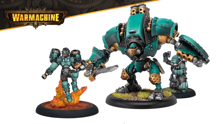 A Crucible Guard Mechanik stands confidently on a base with flames, wearing teal and silver armor, and holding a wrench in one hand. Beside him, a heavy warjack, partially built, features a large arm with a blade and intricate mechanical details, showcasing a mix of teal and metallic colors. The background is minimal, allowing the focus to remain on the Mechanik and the warjack.