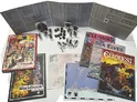 Open booklets and maps spread across a white surface. Visible book covers include "Elfbook" by Steve Perrin, "Worldbook" by Steve Perrin, "Elf-War," "The Sea Elves," and "The Elforests." Miniature figures, dice, and cardboard standees are arranged between the books. One map shows a coastal region labeled "Golthaven." Text on the open pages is too small to read clearly.