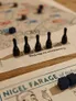 Five black bowling pin-shaped pieces on a board with text "Countdown to Bin Day" and "FARAGE of Reform".