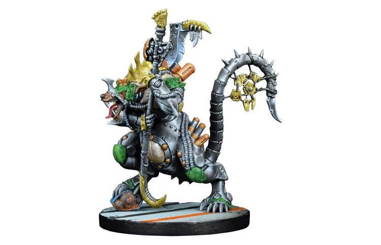 A detailed miniature of a Verr-Myn character stands prominently, showcasing a muscular, anthropomorphic rat-like figure. The creature is adorned with a mix of metallic armor and vibrant green accents, featuring a fierce expression and a prominent spiked tail. It wields a large weapon in one hand, while various mechanical components and weaponry are attached to its body, emphasizing its role as a formidable warrior in the tabletop gaming universe. The base is painted with a simple design, enhancing the focus on the character itself.