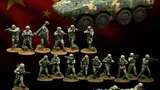 A collection of miniature figures representing China's People's Liberation Army (PLA) is displayed against a backdrop of the Chinese flag. The set includes various contemporary infantry soldiers in camouflage uniforms, special operations troops, and unmanned ground vehicles (UGVs). A prominently featured armored vehicle is also present, alongside soldiers in different poses, some standing with weapons, others in prone positions, and two quadruped UGVs positioned on the ground.