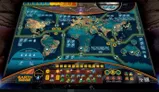 A detailed game board for "Earth Siege: Arrival" features a world map divided into regions, including North America, South America, Africa, Europe, Asia, and Oceania, with various icons representing military and political elements. The board includes a turn track and combat track at the bottom, along with indicators for human base defense and resources. Bright colors and a futuristic design enhance the thematic elements of an alien invasion scenario.