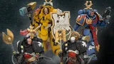 Four Warhammer 40,000 action figures: yellow, blue, and two black-armored. Text: "JOYTOY WARHAMMER 40,000 REINFORCEMENTS IMMINENT! ULTRAMARINES, IMPERIAL FISTS &