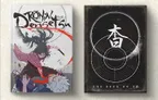 The image features two RPG books side by side. On the left, "Rōnin Densetsu" showcases a dynamic cover illustration of a fierce warrior in a flowing red kimono, wielding a sword, with a dramatic background of splattered blood and a defeated figure. On the right, "The Book of Yo" has a minimalist black cover with white circular designs and stylized text, emphasizing its supernatural theme. Both books are designed to expand the lore and gameplay of the Rōnin RPG.