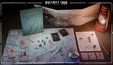 Budapest 1899 game box, map, dice, cards, and pocket watch on a wooden table.
