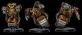 A detailed miniature of a robotic character features a round body with a metallic, silver barrel-like base and a prominent, circular golden core. It has two mechanical arms, one equipped with a green-tipped weapon and the other with a series of intricate gears and glowing green eyes. The figure stands on a textured black base, showcasing a weathered, industrial aesthetic with hints of rust and wear.