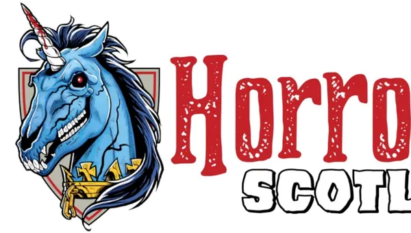 A stylized logo features a blue unicorn with a fierce expression, showcasing sharp teeth and a prominent horn. The unicorn is adorned with a golden collar and is set against a shield-like background. The text "Horror Scotland" is prominently displayed in bold, red letters, with a distressed texture, emphasizing the event's horror theme.