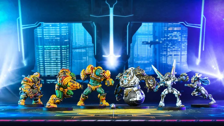 Four colorful miniatures from the game DreadBall: All Stars are displayed on a futuristic arena. On the left, two muscular, green-skinned players in vibrant armor are poised for action, while a third player, clad in metallic silver and black, stands ready with a ball at their feet. To the right, a sleek, humanoid figure in blue and white armor prepares to engage, set against a backdrop of glowing cityscapes and a bright light source in the center.
