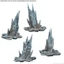 Four unpainted, unassembled gray plastic terrain miniatures resembling jagged rock formations with sharp, uneven spikes rising from flat, irregular bases. Text at the top reads: "MINIATURES ARE SUPPLIED UNASSEMBLED AND UNPAINTED". Text at the bottom right reads: "©2025 MARVEL © AMG".