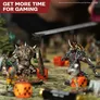 A detailed tabletop gaming scene features two intricately painted miniatures in the foreground: a heavily armored figure wielding a spiked mace and a menacing character adorned with spikes and dark armor. The background is filled with blurred figures and colorful dice, including orange ones, set on a textured gaming mat. A ruler is visible above the miniatures, suggesting gameplay, while a banner in the corner reads "GET MORE TIME FOR GAMING."