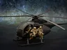 A detailed model of a Little Bird helicopter, featuring a dark color scheme, is prominently displayed. Two miniature soldiers are seated on the helicopter's skids, equipped with rifles, while another soldier is visible inside the cockpit. The background features a textured gradient, enhancing the focus on the helicopter and its crew.