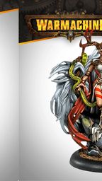 The image features two intricately designed miniatures from the Warmachine Khador Old Umbrey Auxiliary Expansion. On the left, a figure with a skeletal, branch-like appearance holds a staff, adorned with various textures and details. On the right, a witch, Olesea Reznikova, is depicted in a dynamic pose, wearing a mix of armor and flowing garments, with a serpent coiling around her arm and a dramatic backdrop of fur and foliage. Both miniatures are set against a light gradient background, emphasizing their detailed craftsmanship.