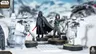 A detailed scene features Darth Vader standing prominently with his red lightsaber drawn, dressed in his iconic black armor and cape. Flanking him are two Stormtroopers, one aiming a blaster, set against a snowy landscape with scattered debris and structures. The miniatures are mounted on circular bases, showcasing their intricate designs and the dynamic pose of the characters.