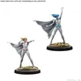Two unpainted miniatures of female superheroes with capes on circular bases.