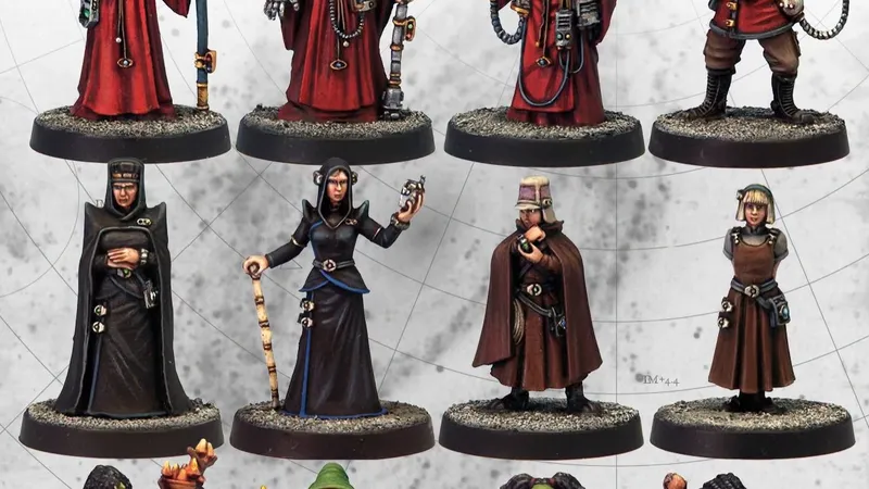 12 painted sci-fi miniatures in 3 rows, various robes and weapons.