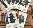 Assorted illustrated game cards with characters like Smuggler, Steed, and a rabbit warrior on a fantasy map.