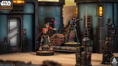 A customisable Separatist Super Tactical Droid stands prominently on a sandy surface, showcasing its multipart design with a metallic body, red accents, and a distinctive head. It is positioned near a futuristic structure with a large door and control panel, while a second droid, holding a weapon, is partially visible in the background. The scene is set in a sci-fi environment, typical of the Star Wars universe, with detailed textures and colors enhancing the overall aesthetic.