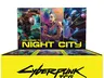 A brightly colored display box for the Cyberpunk Trading Card Game features a vibrant design with the text "WELCOME TO NIGHT CITY" prominently displayed at the top. The back of the box showcases three characters: a cybernetic figure, a woman with colorful hair and tattoos, and a man in a futuristic outfit, all set against a neon-lit backdrop. The bottom of the box is yellow with the title "Cyberpunk TCG" and the logo of CD Projekt Red, emphasizing the game's connection to the Cyberpunk universe.